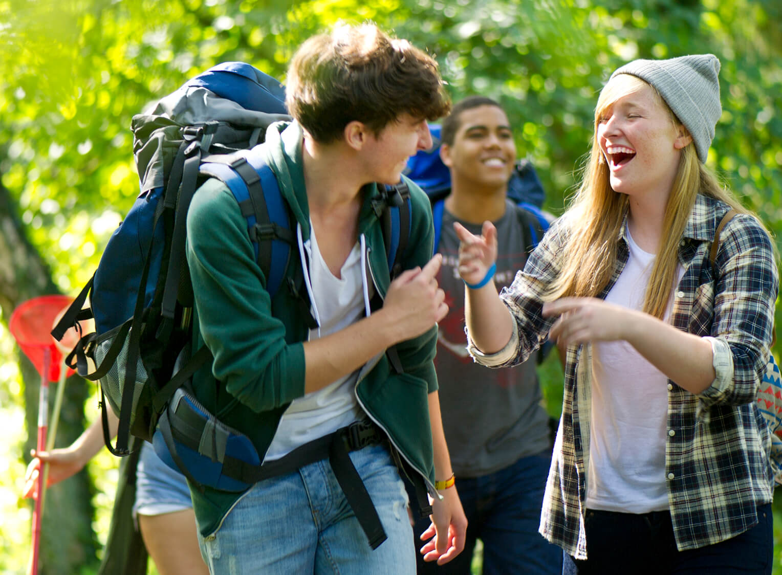 A group of friends hiking and laughing.